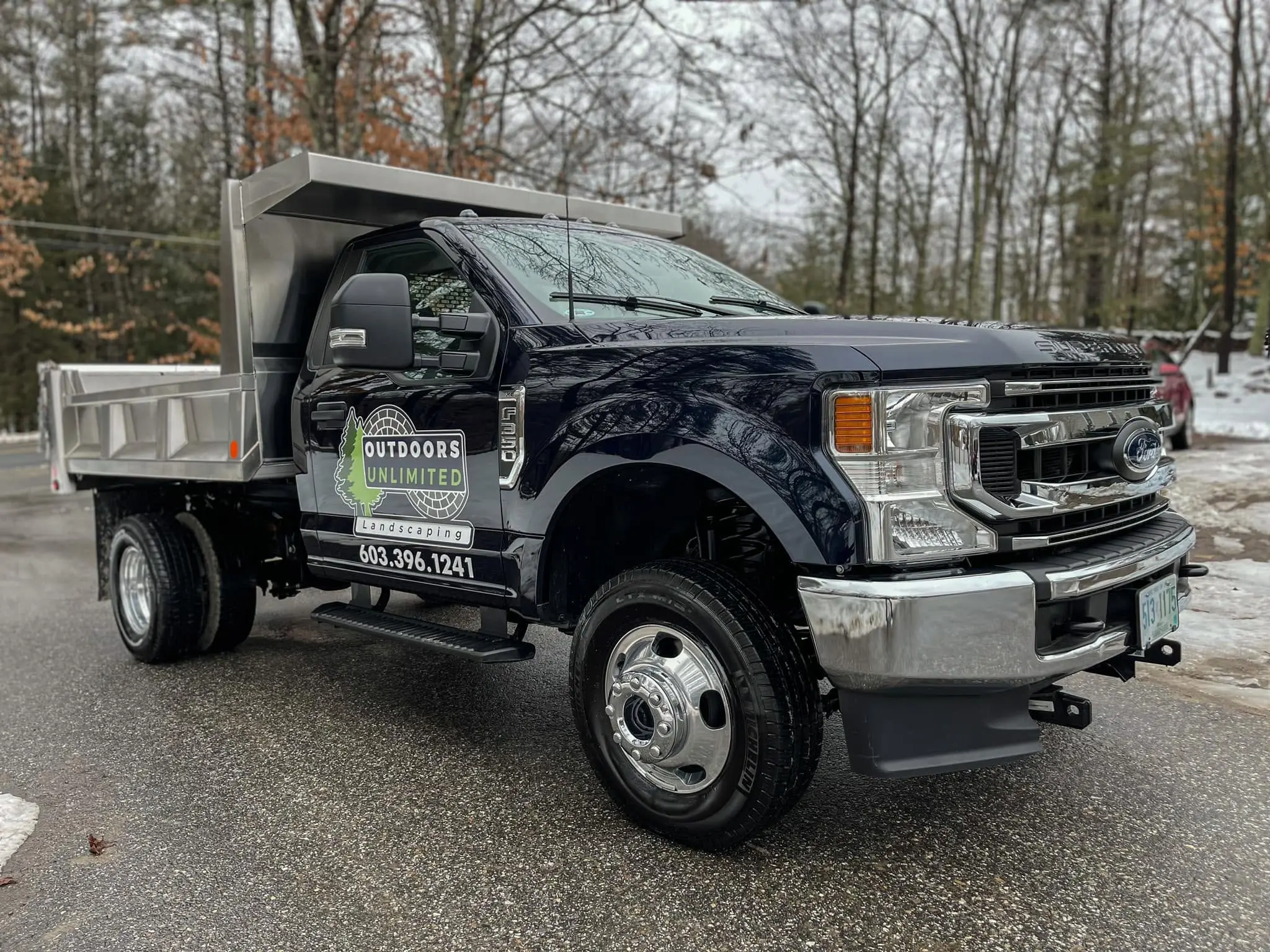Black landscaping dump truck from a local business fleet detailed by Midnight Detailing in New Hampshire