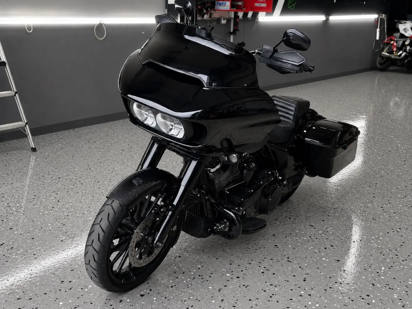 Black Harley-Davidson Road Glide after paint correction and ceramic coating by Midnight Detailing in Newton, New Hampshire