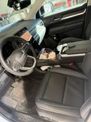 Vehicle interior before professional interior detailing by Midnight Detailing
