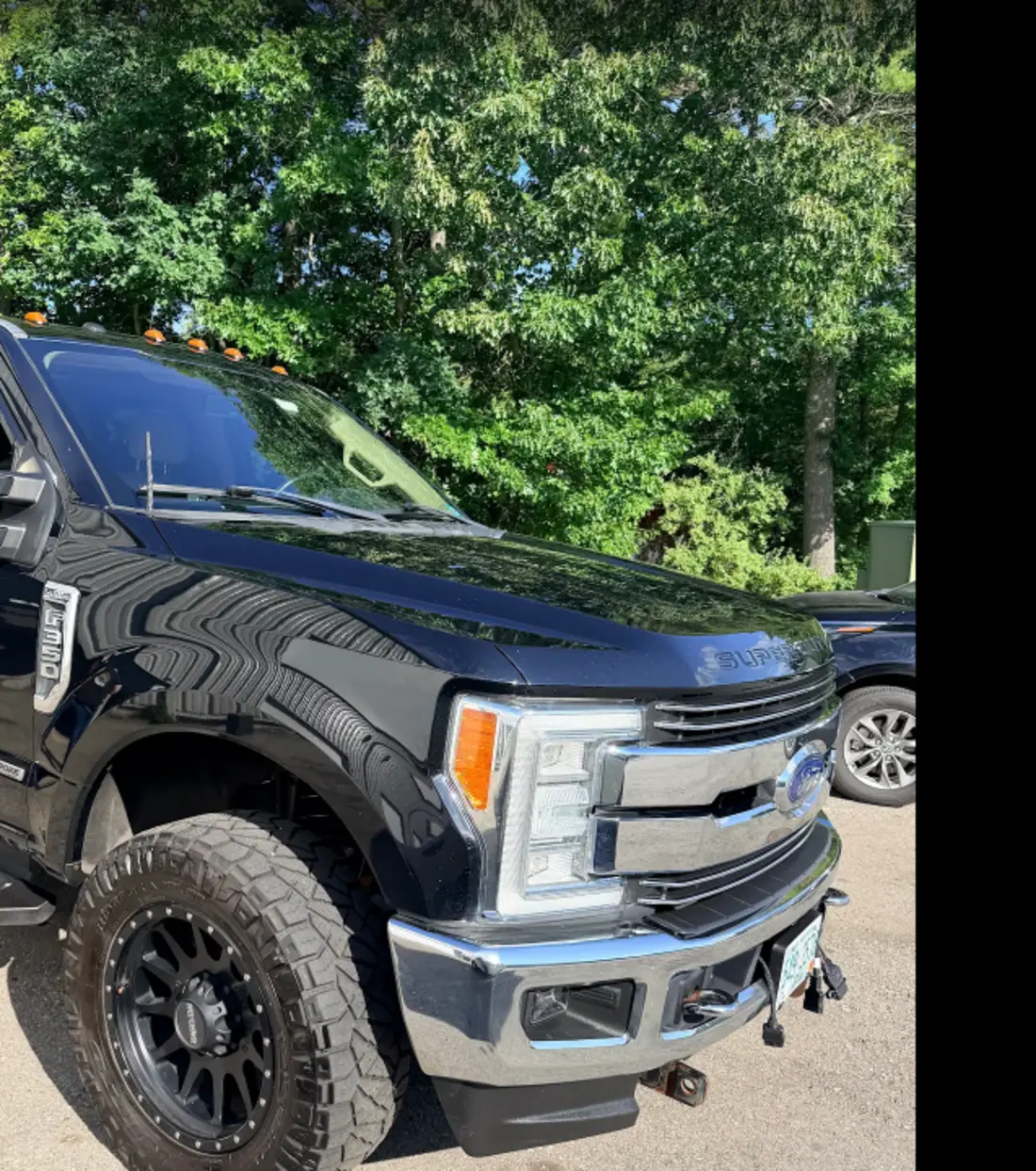 Black Ford Super Duty after professional detailing and polishing by Midnight Detailing in Newton, New Hampshire