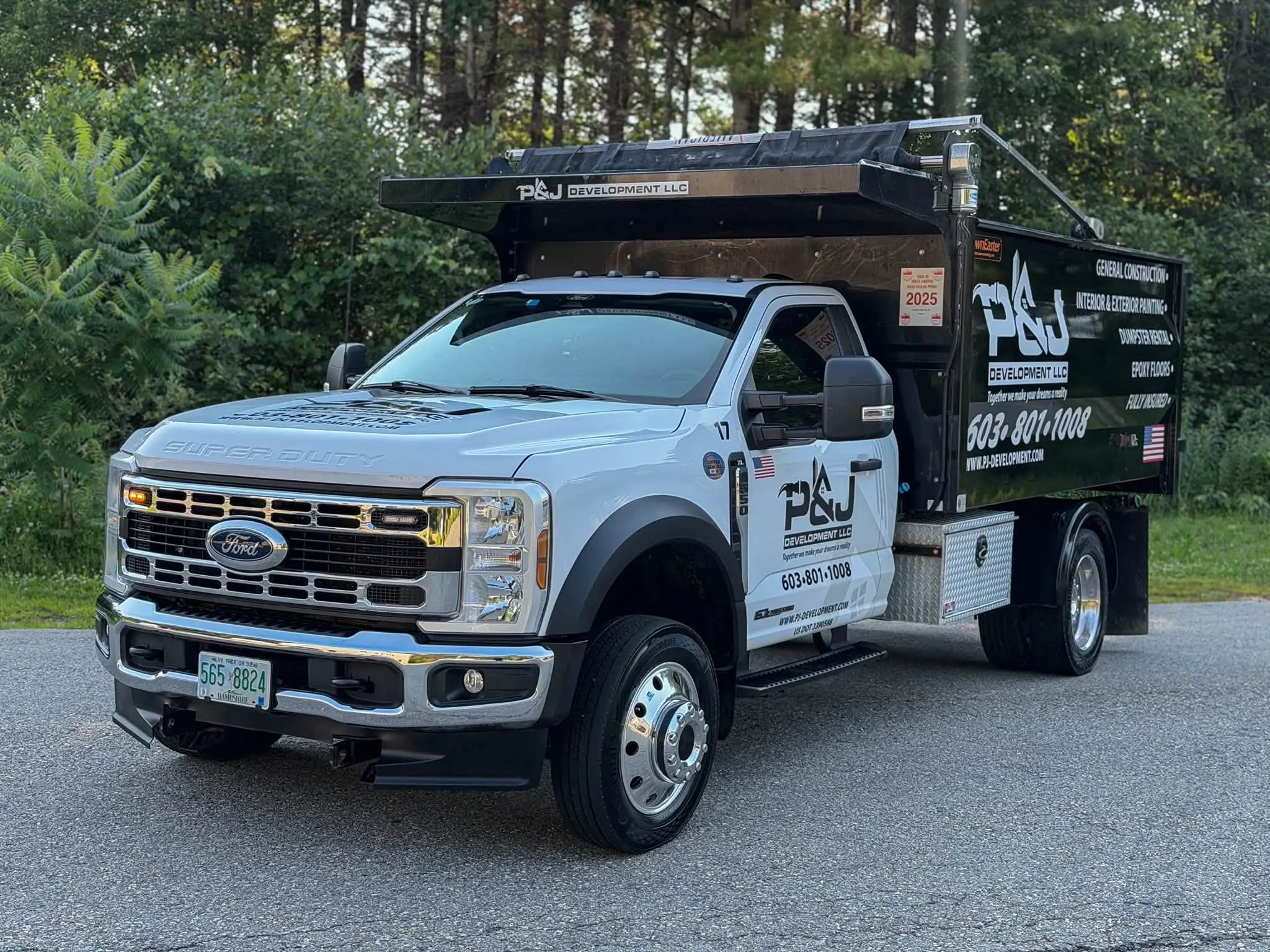 White Ford Super Duty dump truck from a local business fleet detailed by Midnight Detailing